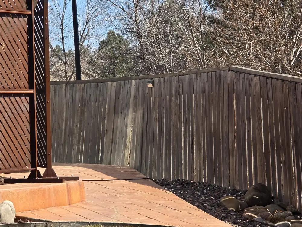 Backyard before fence patio and landscape restoration