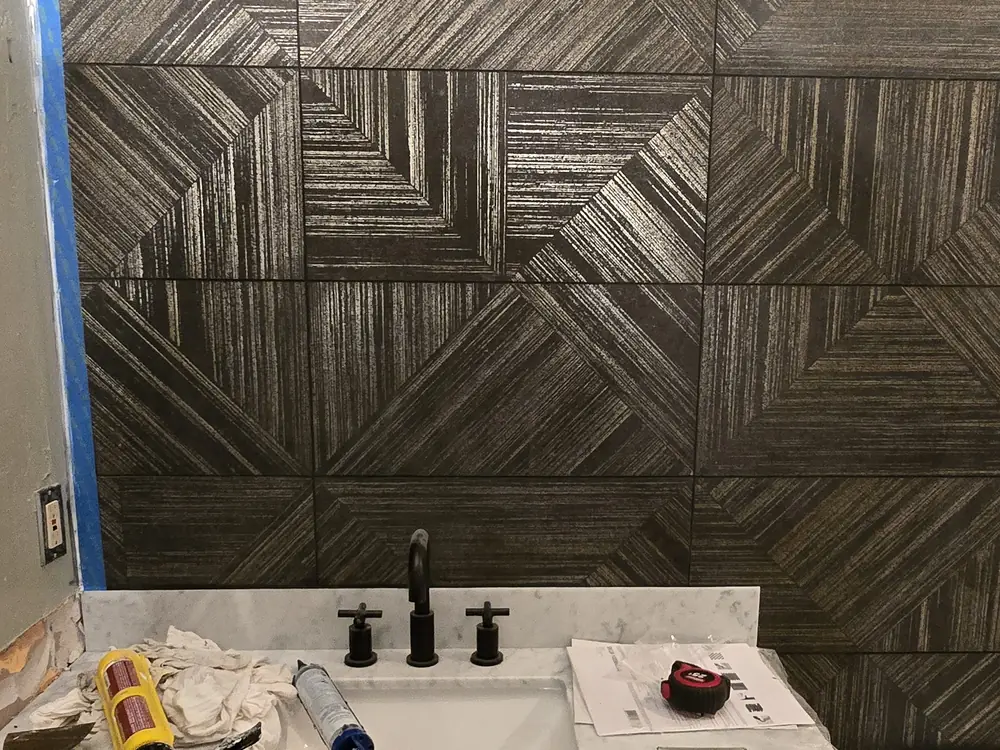 Geometric wall tile in a finished Breckenridge bathroom