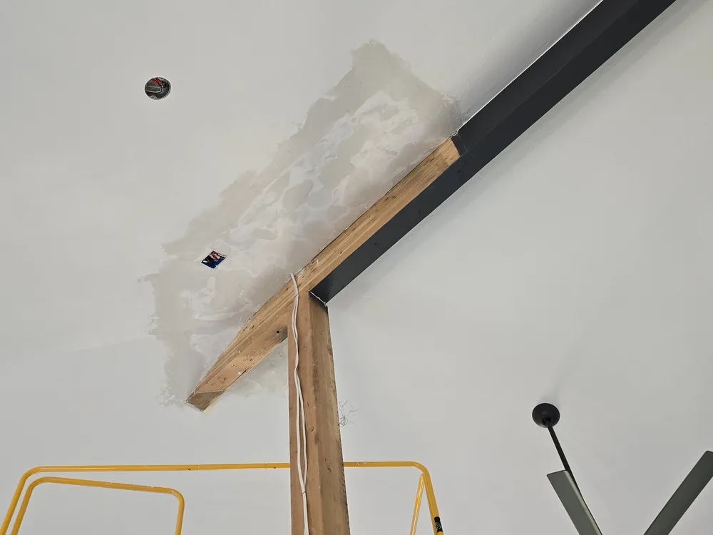 Drywall finishing around a ceiling beam in Breckenridge