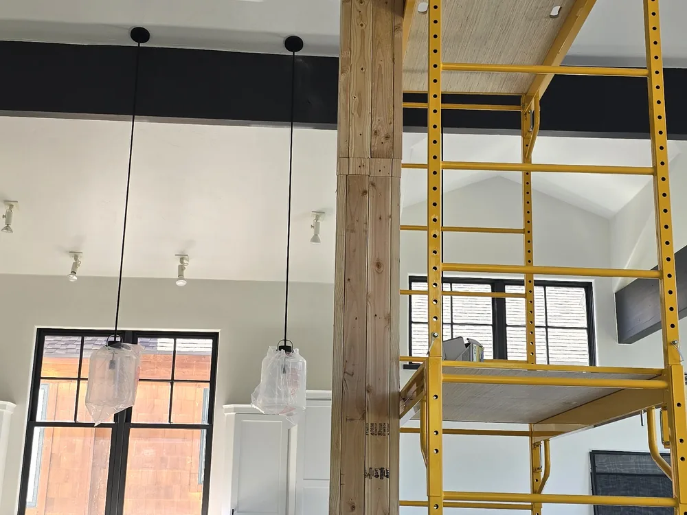 High-wall finish work in a vaulted room