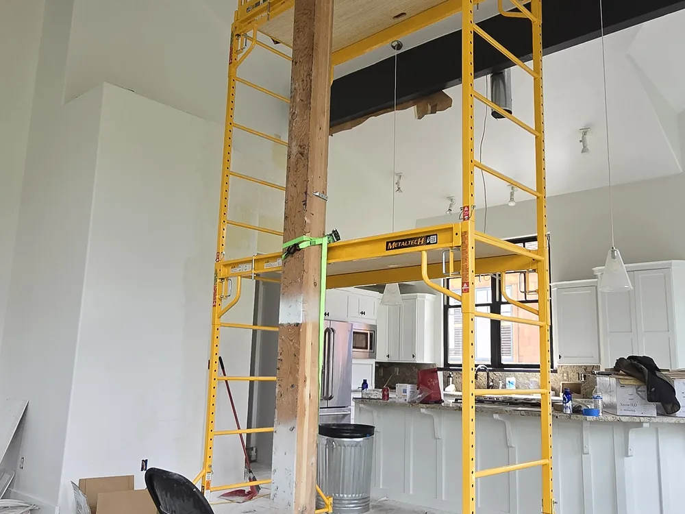 Tall walls and vaulted ceiling prepared for painting