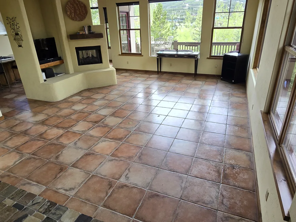 Before view of the living area and tile floor in the same Breckenridge home