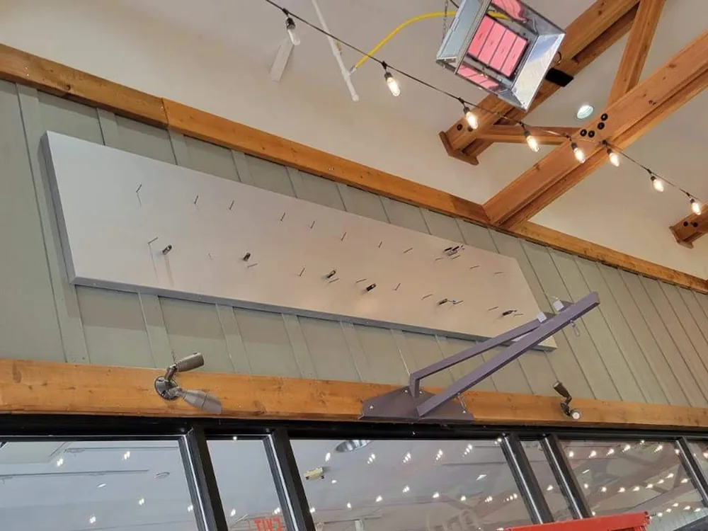 Interior retail sign installation in progress