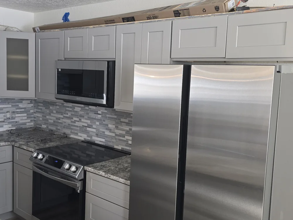 Gray cabinet kitchen after remodeling at Orofino Condominiums in Dillon