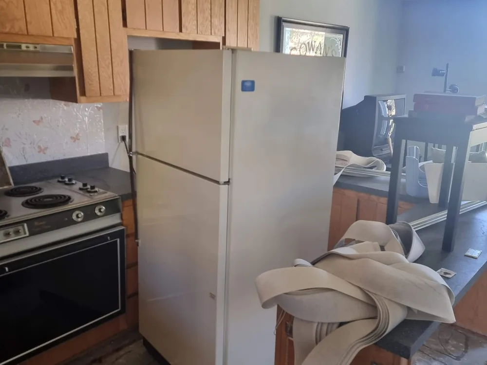 Before view of a dated kitchen at Orofino Condominiums in Dillon