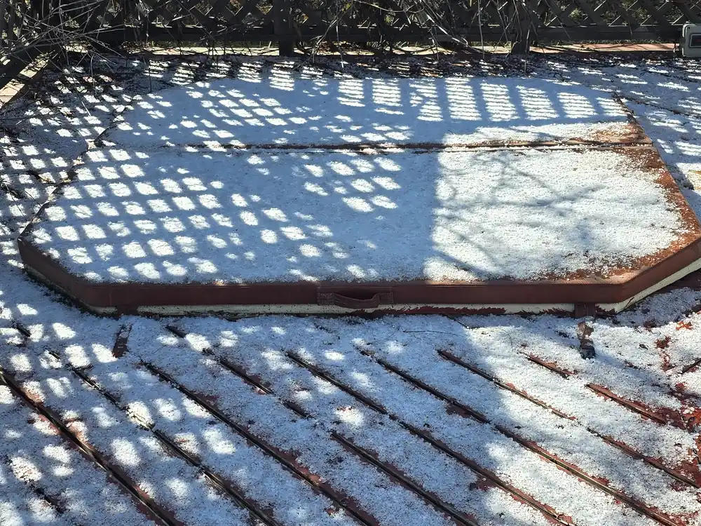 Before view of the same weathered backyard deck