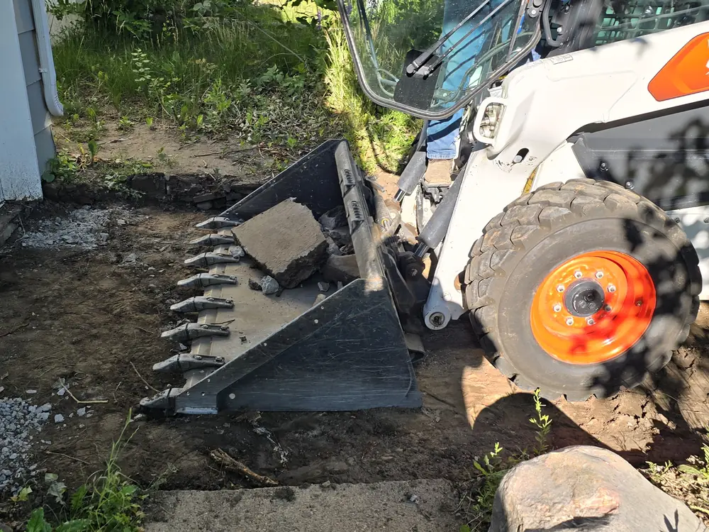 Concrete removal during a driveway repair