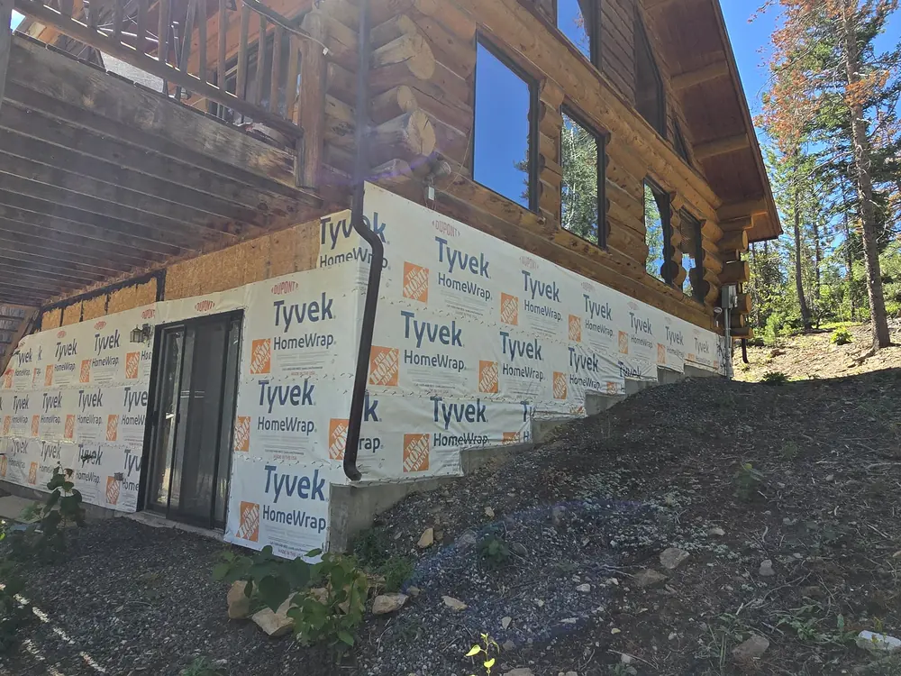Wrapped foundation walls before stone veneer installation