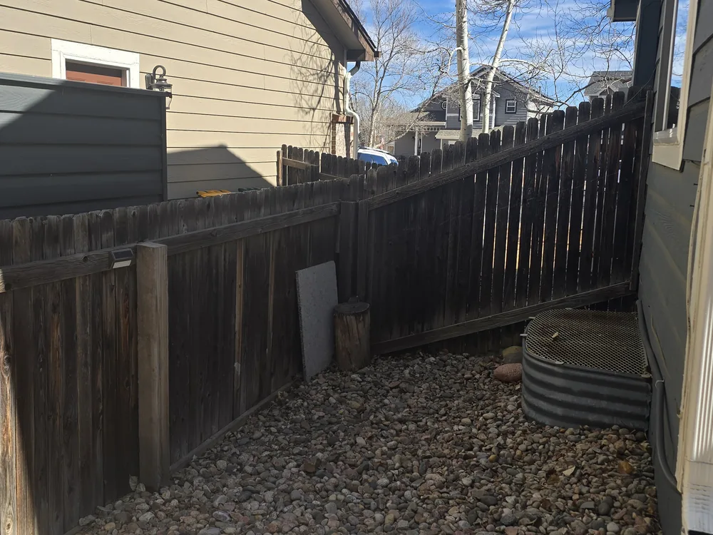 Wide view of a faded residential fence